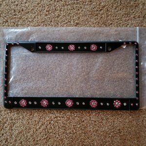 Metal license plate holder with crystals